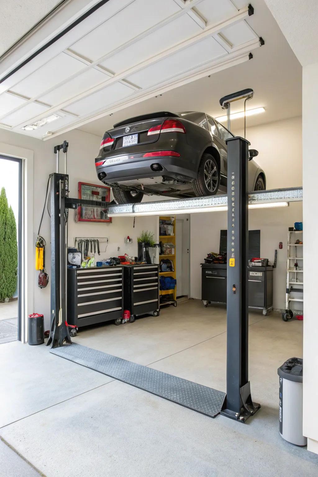 A two-post lift in a home garage offers easy access for car maintenance.