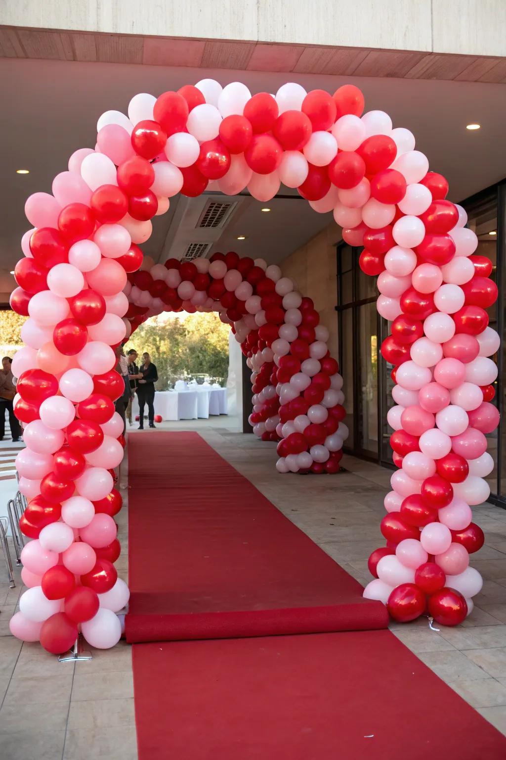 A grand heart balloon arch makes a stunning entrance for romantic events.