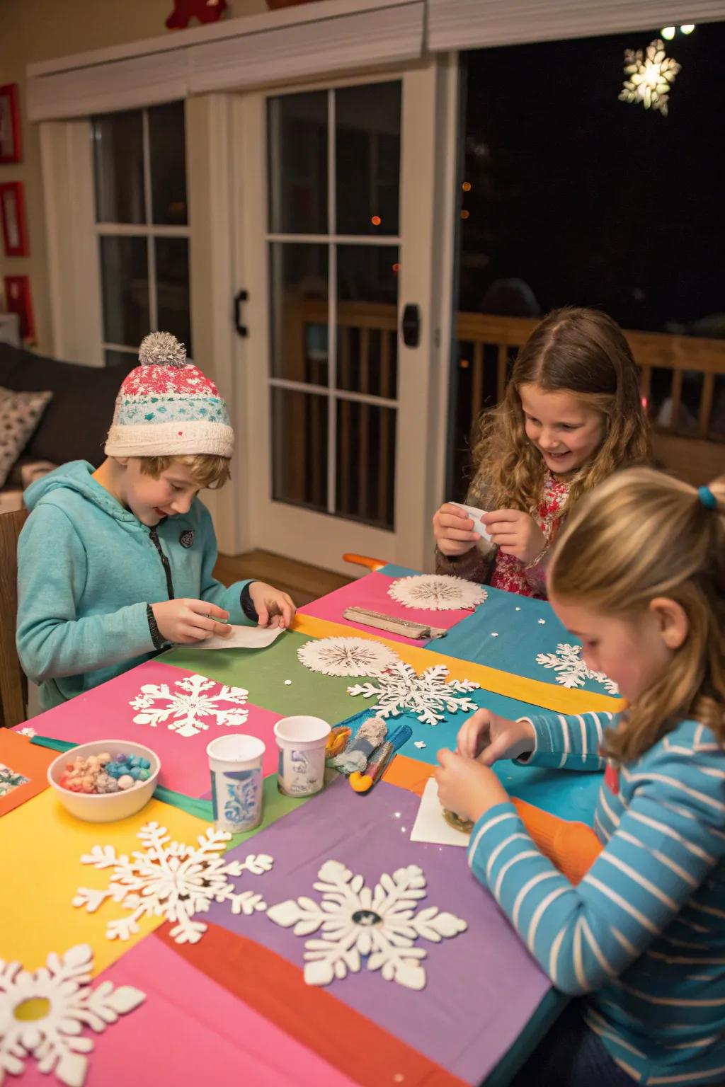 Children engaging in creative winter crafts at a colorful table.