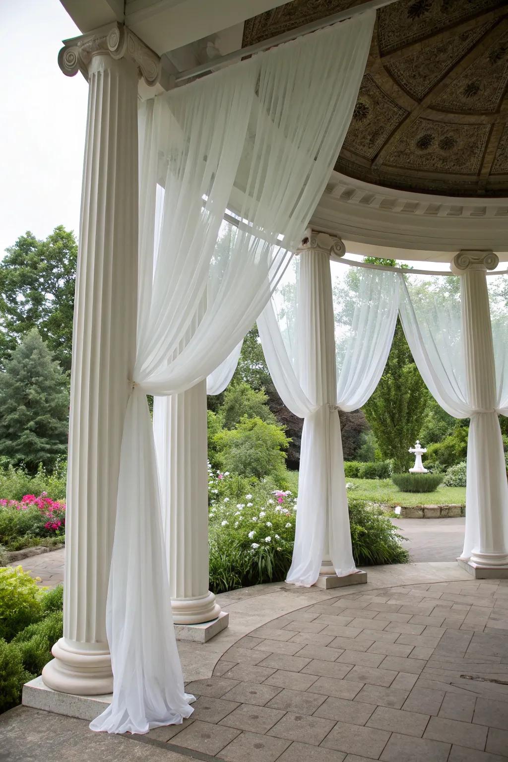 Flowing white chiffon drapery sets a romantic tone for the wedding.