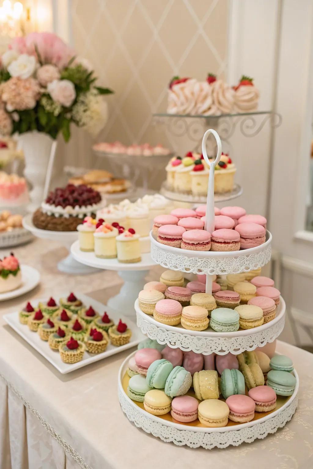 A wedding dessert bar showcasing pastel macarons and mini carrot cakes.