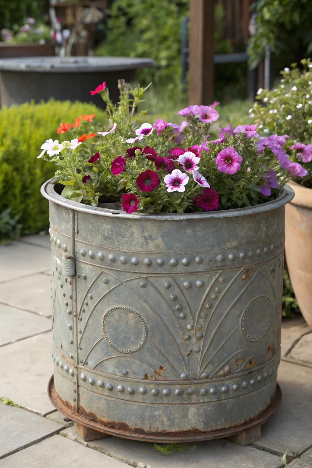 Transform scrap into stunning: a vibrant floral display in a repurposed washing drum planter.
