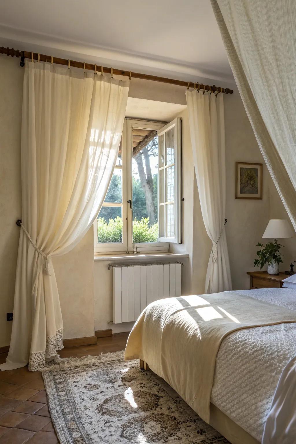 Light drapes enhance natural light in a small bedroom.