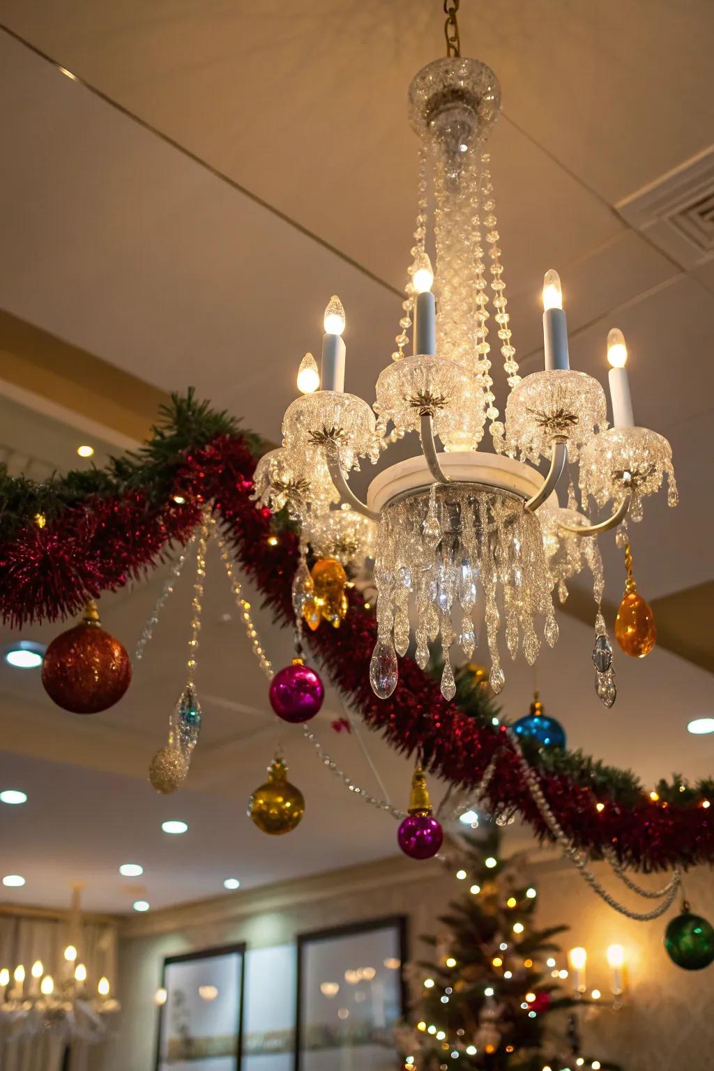 A tinsel-adorned chandelier adds a glamorous holiday touch.