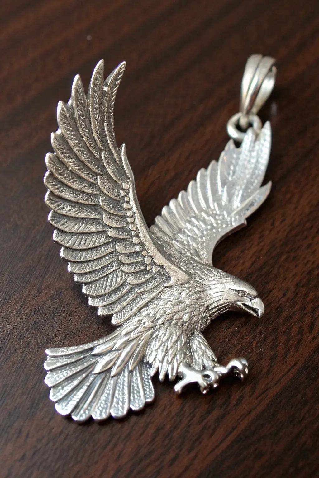 Elevate your style with a touch of wilderness: handcrafted eagle pendant in stunning silver.