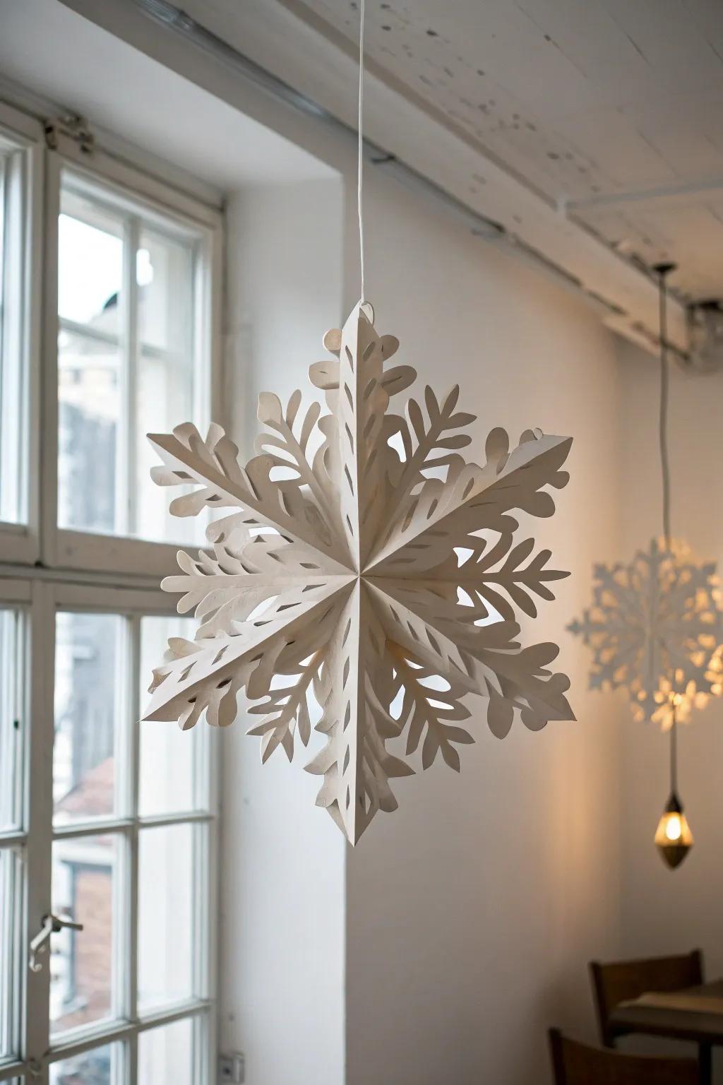 Transform your space into a serene winter wonderland with delicate paper snowflakes that float gracefully from the ceiling.