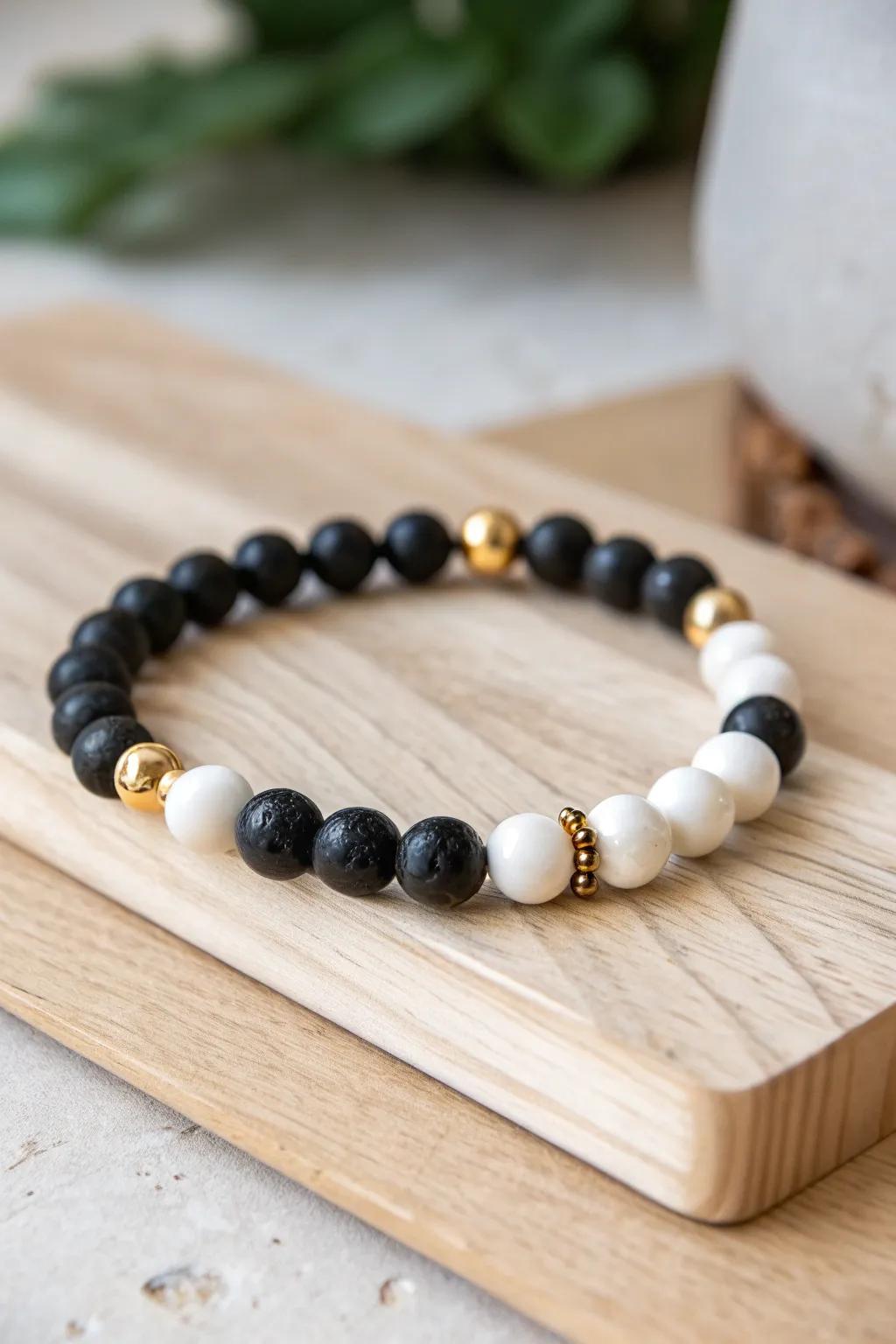 Eerie Elegance: Embrace a sophisticated twist on Halloween with this chic black, white, and gold bead bracelet.