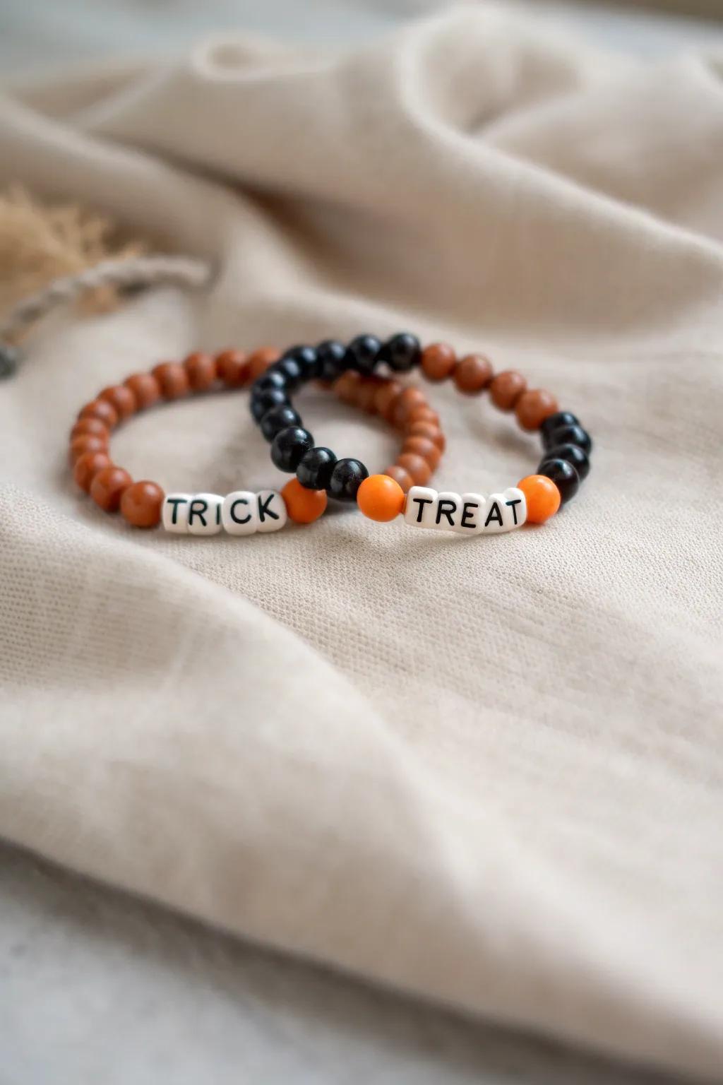 Celebrate Halloween with a touch of minimalist elegance: 'TRICK' and 'TREAT' in clay bead style.