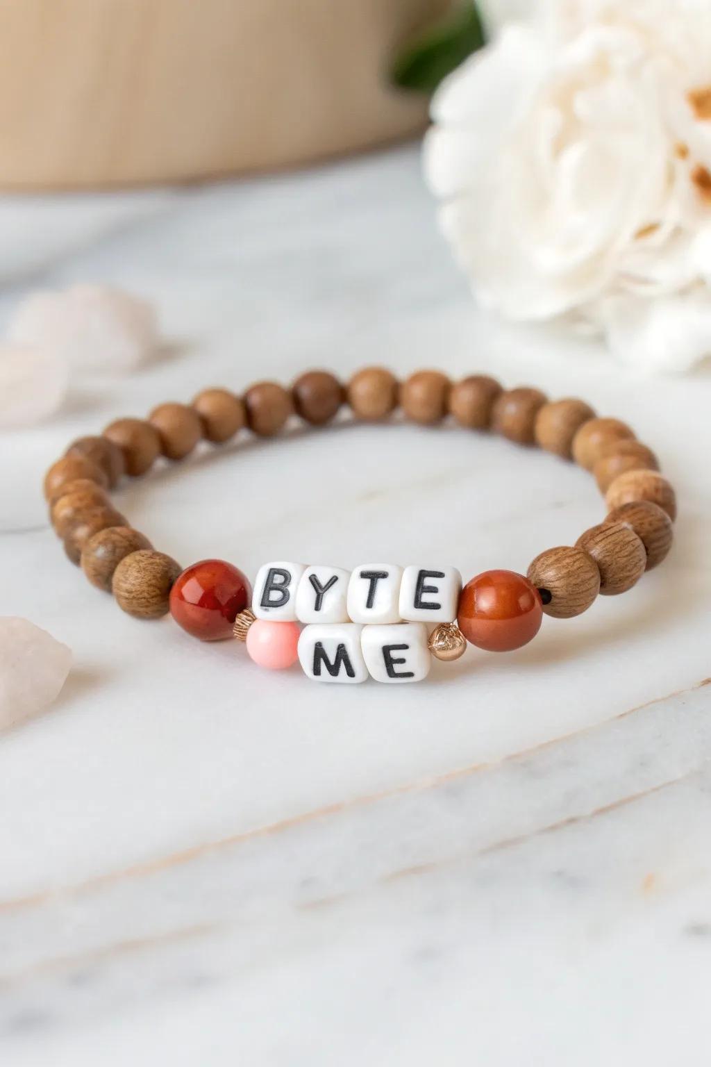 Add a touch of tech-savvy humor to your style with this chic 'Byte Me' bead bracelet.