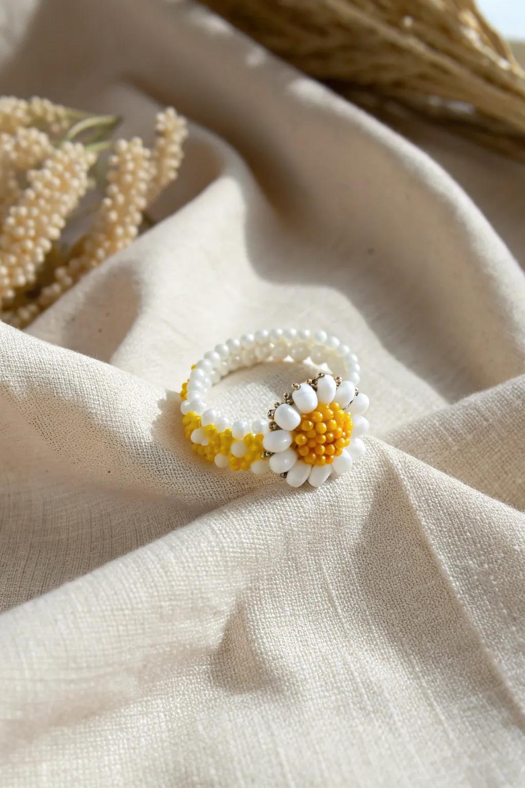 Embrace the essence of spring with this charming daisy-inspired beaded ring, perfect for adding a touch of sunshine to any day.