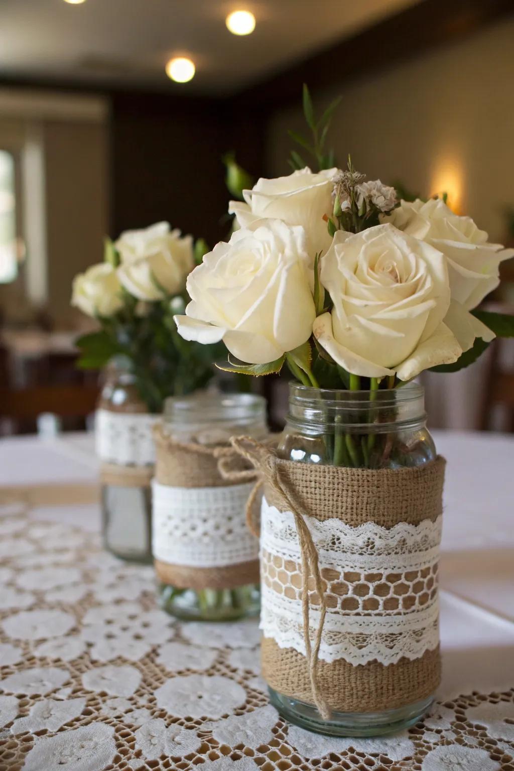 Elegant mason jars with burlap and lace.