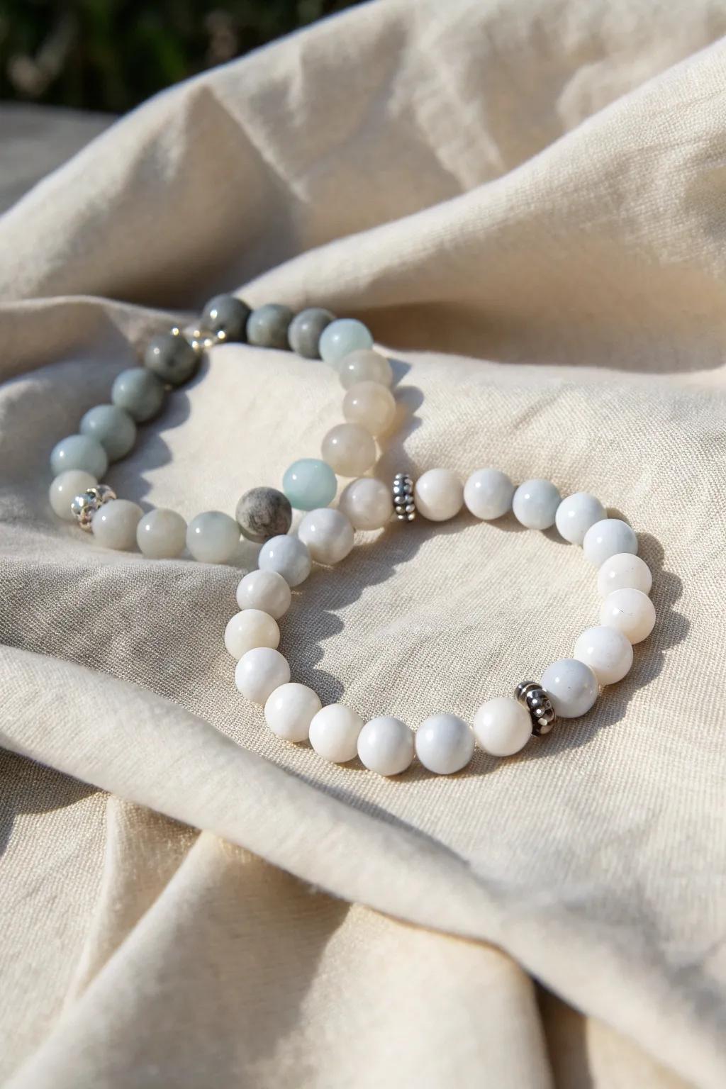 Embrace the elegance of simplicity with this monochrome magic bead bracelet.