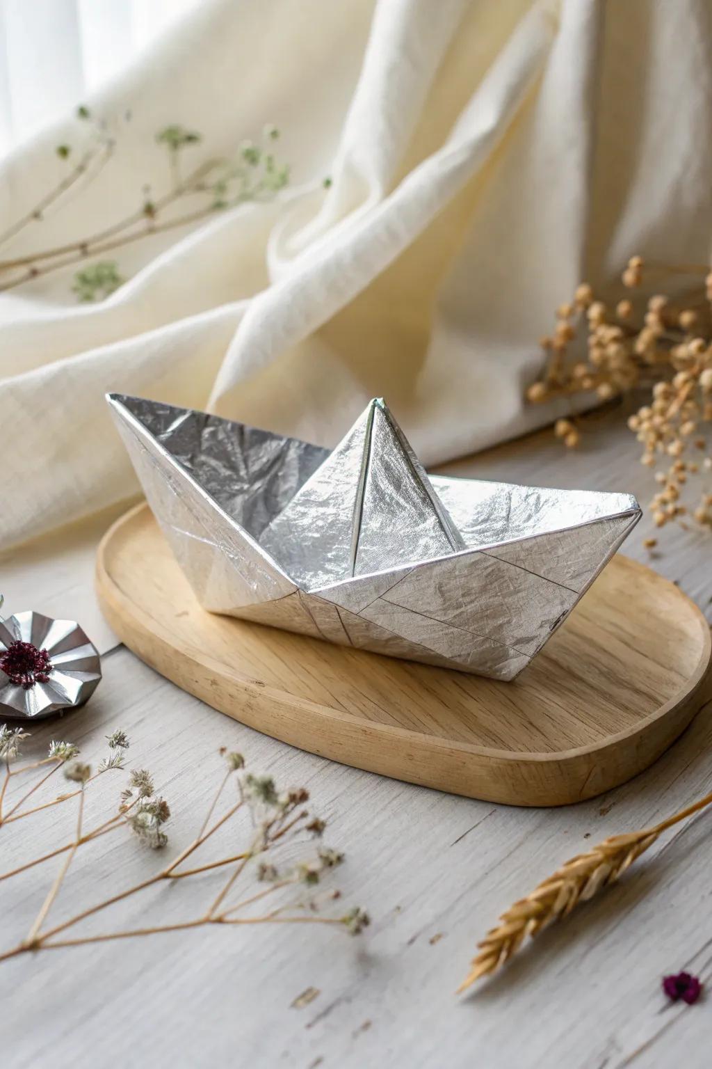 Sail into simplicity with this sleek, shiny foil origami boat—proof that beauty floats in minimalism.