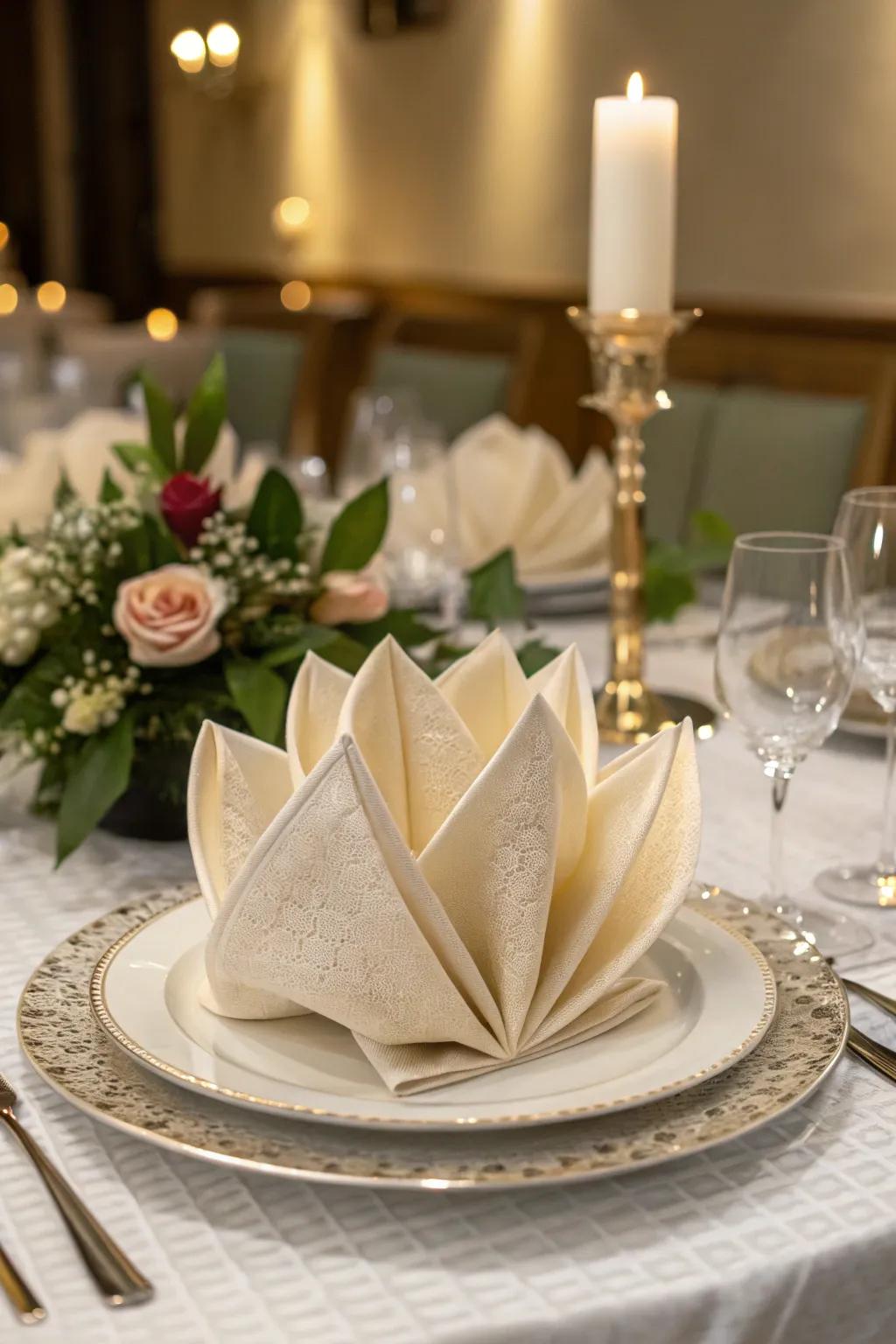A silk napkin delicately folded into a lotus blossom, adding a natural elegance to the table.