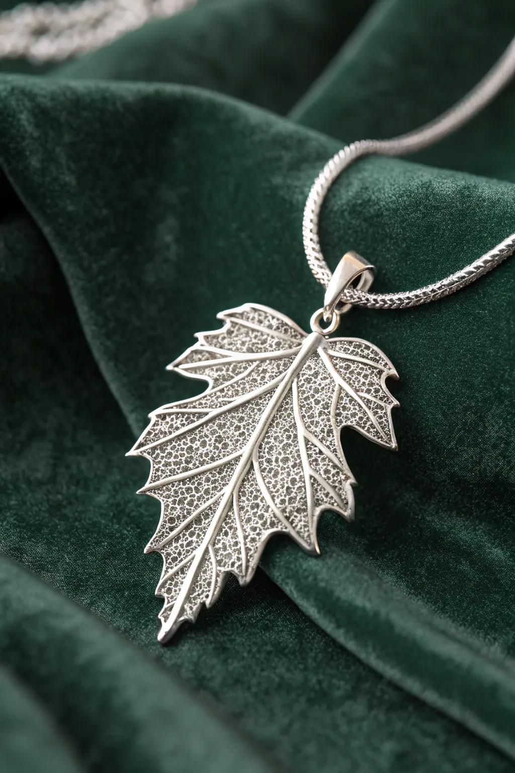 Capture the elegance of nature with this intricately designed leaf pendant.