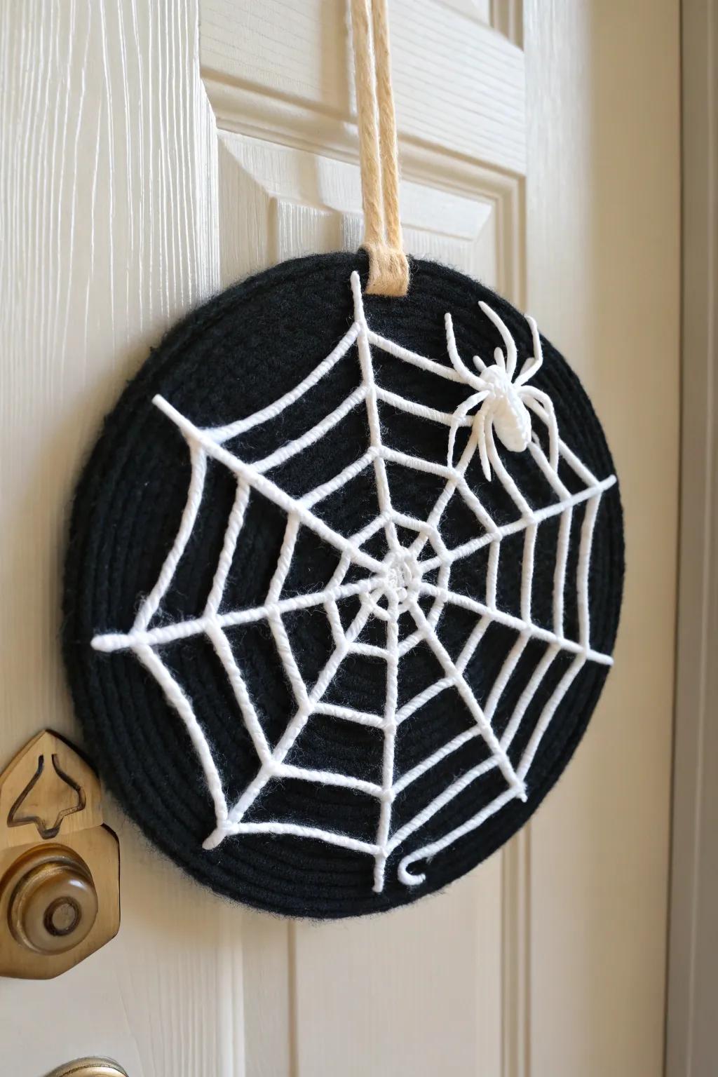 Embrace eerie elegance with this handcrafted spider web door hanger, perfect for a minimalist Halloween touch.
