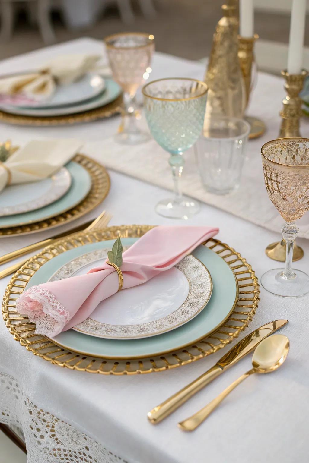 Elegant wedding tableware featuring gold accents and pastel napkins.
