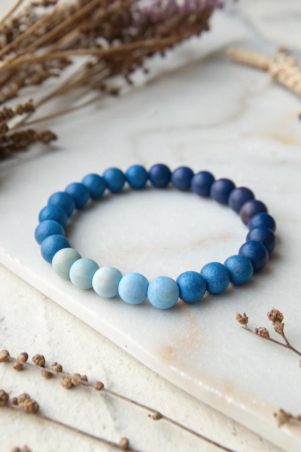 Elevate your summer style with a beautifully crafted ombre clay bead bracelet, where simplicity meets elegance.