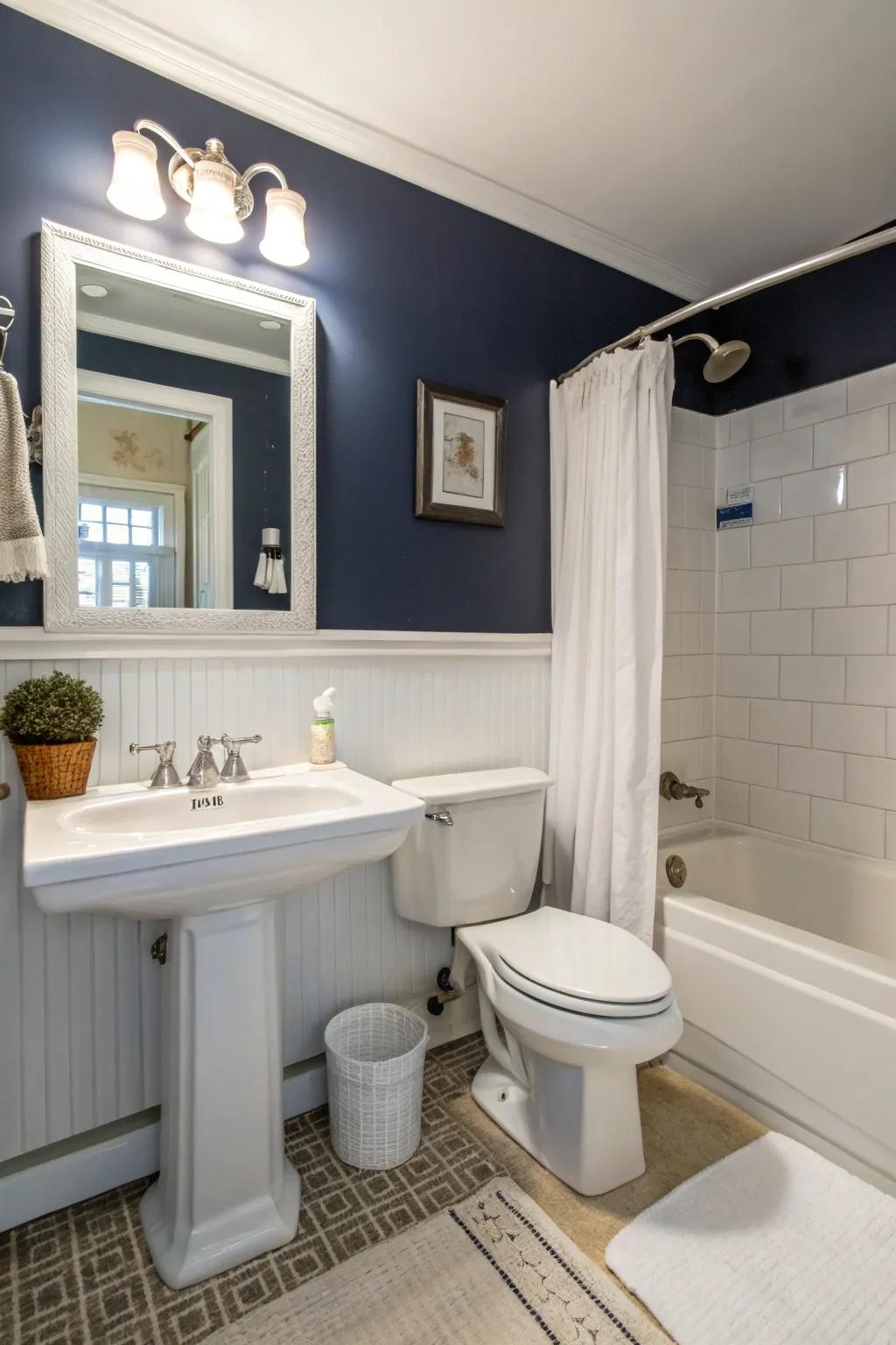Navy walls create a dramatic and luxurious atmosphere in this modern bathroom.