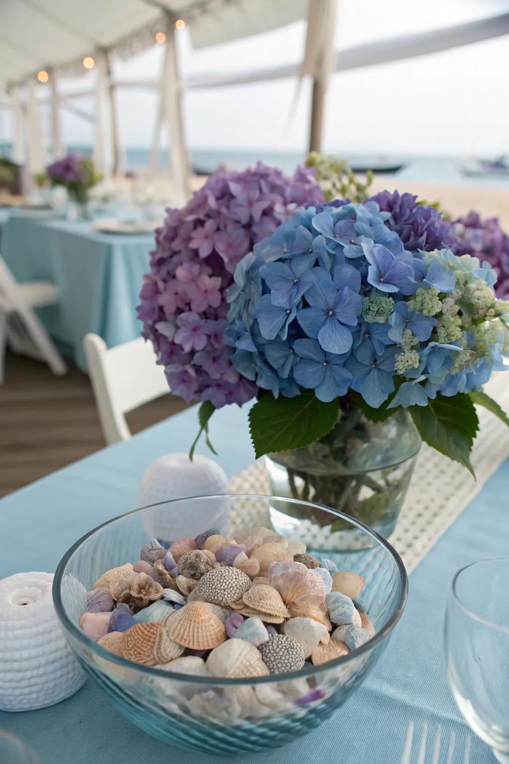 Hydrangeas paired with seashells create a coastal centerpiece.