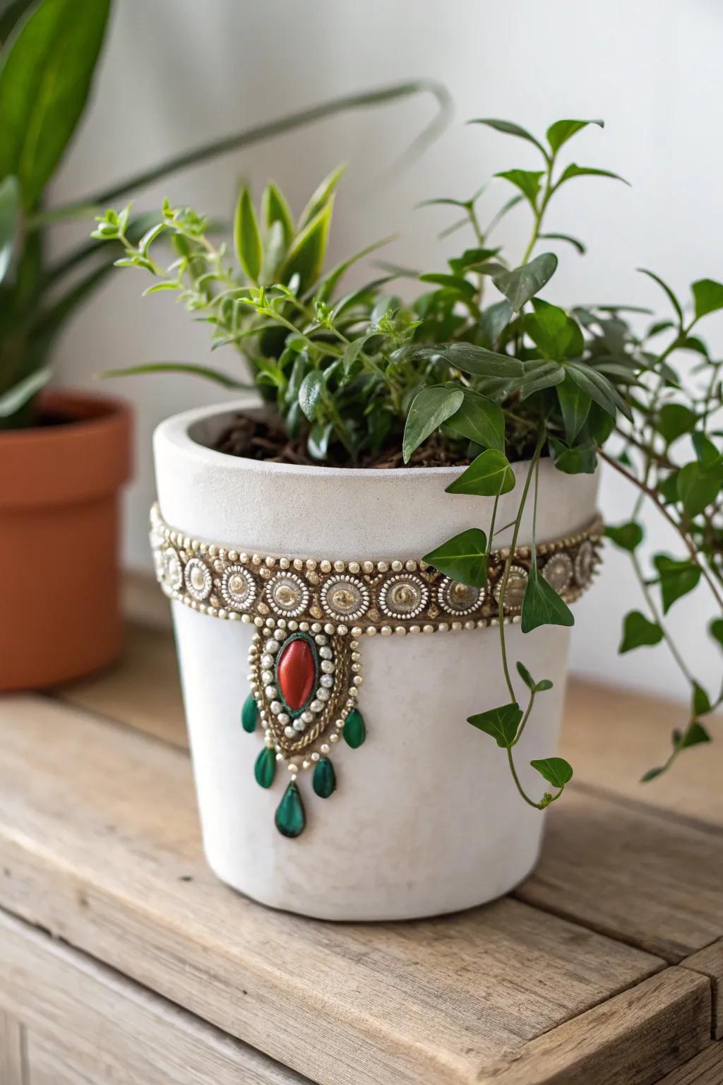 Elevate your green space with a touch of glam by adorning planters with boho jewelry.