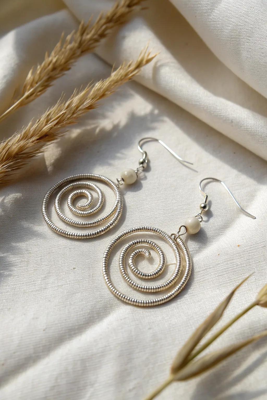 Discover the art of simplicity with these elegant spiral wire earrings, where craftsmanship meets minimalist beauty.