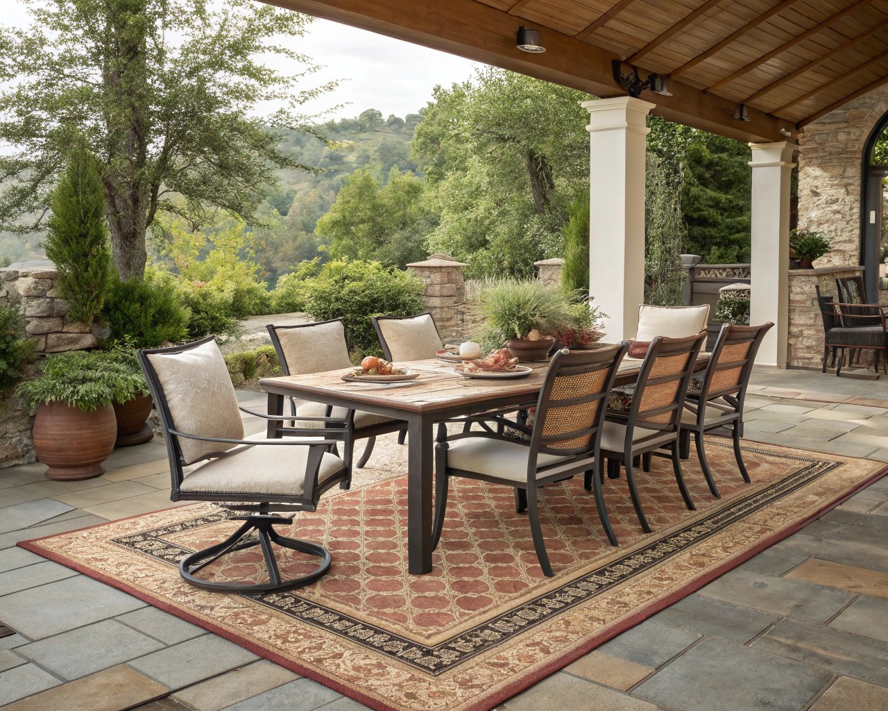 An outdoor dining area with a perfectly sized rug ensuring comfortable and stylish dining experiences.