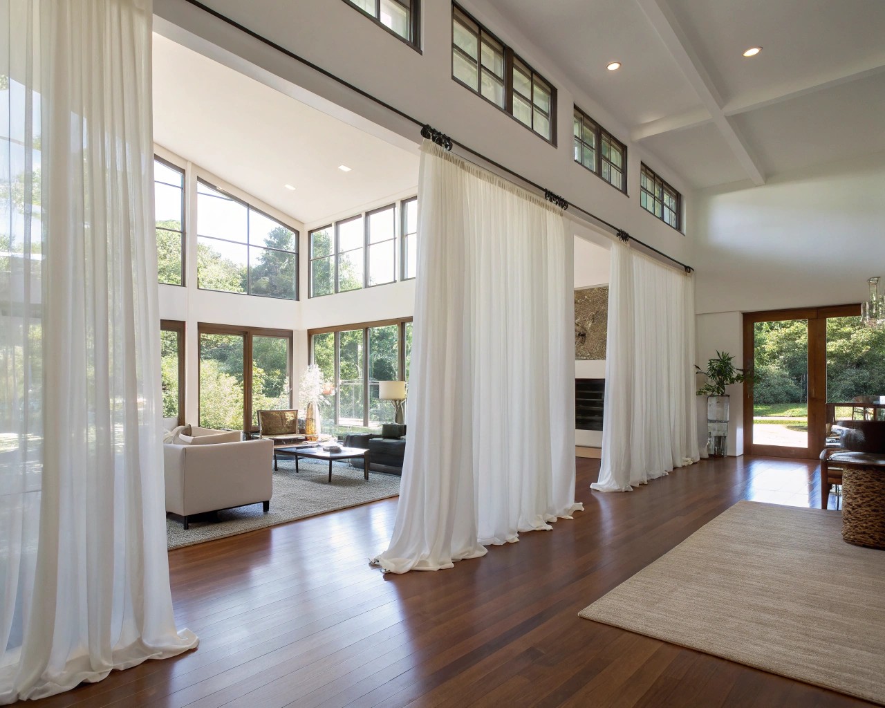 Curtains define space while preserving light and openness.
